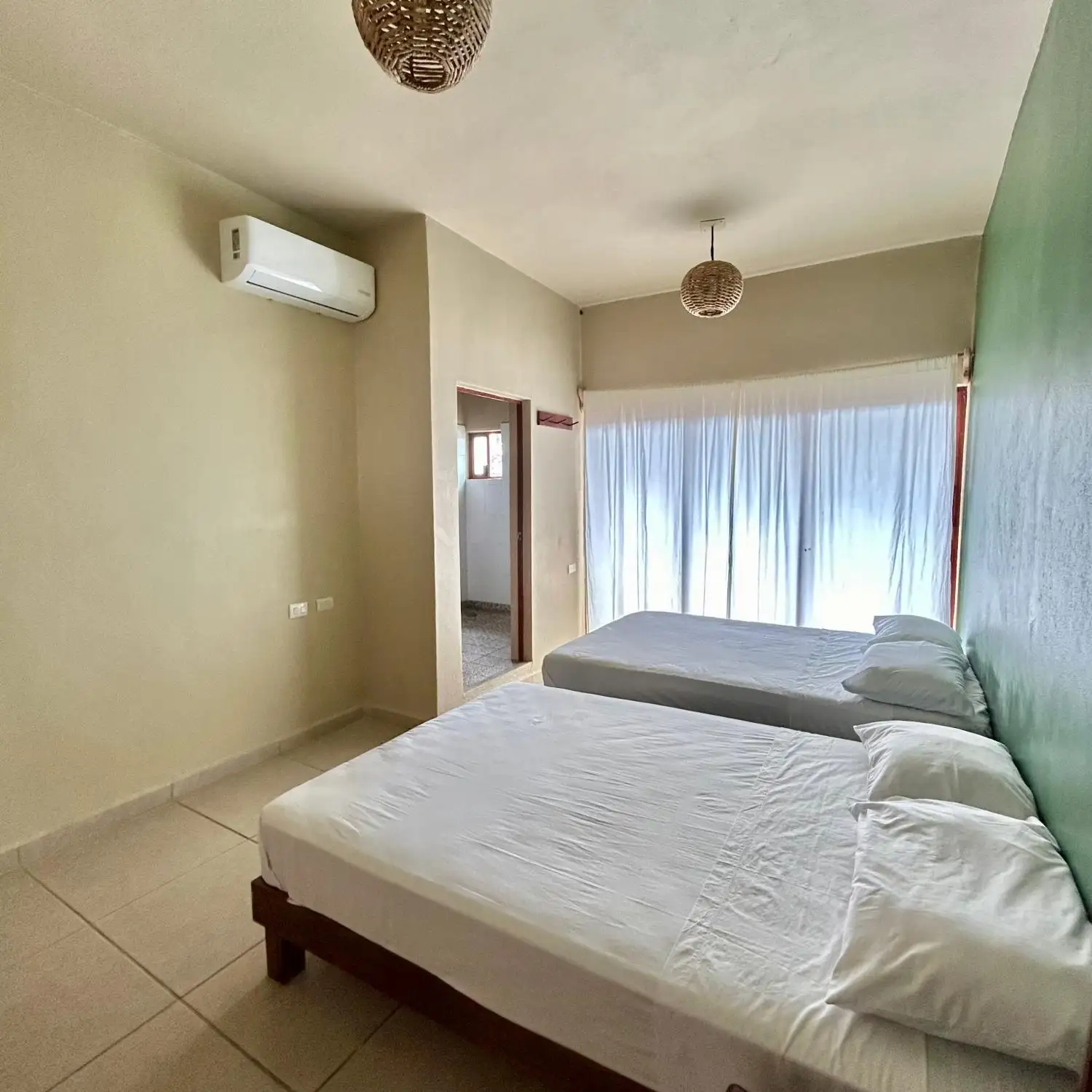 Una cama o camas en una habitación de Casa Yeé Lo Beé Mazunte